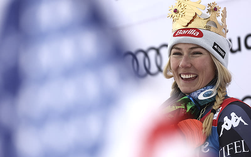 Mikaela Shiffrin of the United States smiles on the podium after winning in alpine ski, women’s World Cup giant slalom, in Kronplatz, Italy, on Jan. 24. Shiffrin won a record 83rd World Cup race on Tuesday. <em>Associated Press/Gabriele Facciotti</em>