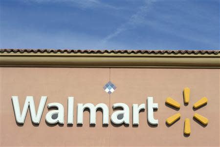 The Wal-Mart logo is pictured at its store in the Porter Ranch section of Los Angeles, California in this November 26, 2013 file photo. REUTERS/Kevork Djansezian/Files