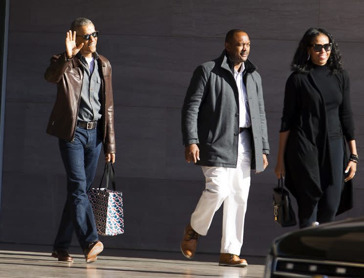 Former President Barack Obama accompanied by former first lady Michelle Obama waves as they leave the National Gallery of Art in Washington, Sunday, March 5, 2017. (Photo: AP Photo/Jose Luis Magana)