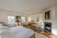 <p>In total, the home has 10 bedrooms, including this cozy number with a fireplace and sitting area. <br> (Christie’s International Real Estate) </p>