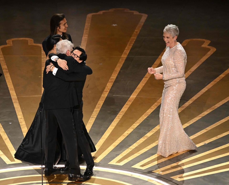 Huy Quan hugs Harrison Ford  (Patrick T. Fallon / AFP - Getty Images)