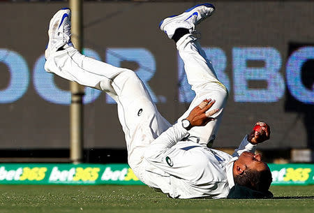 Cricket - Australia v South Africa - First Test cricket match - WACA Ground, Perth, Australia - 5/11/16 Australia's Usman Khawaja dives to take a catch to dismiss South Africa's Temba Bavuma at the WACA Ground in Perth. REUTERS/David Gray