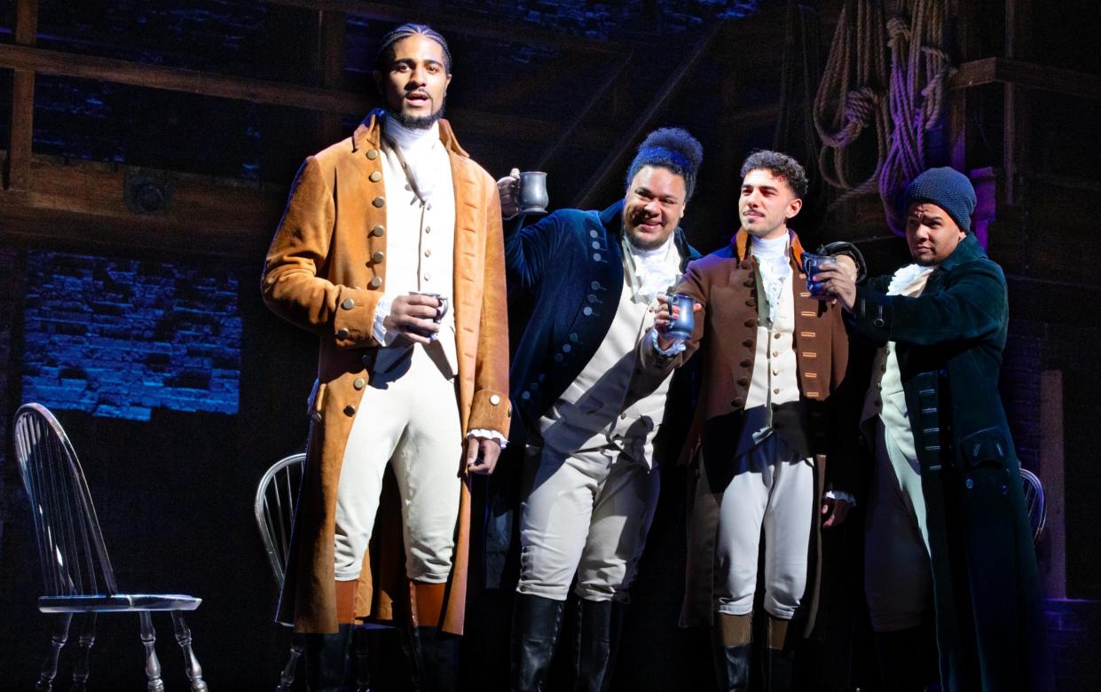 Declan Spaine (as Hamilton) and cast at the Victoria Palace Theatre