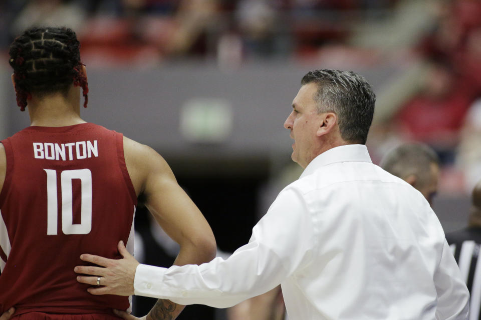 Washington State coach Kyle Smith, right, speaks with guard Isaac Bonton (10) during the second half of the teams NCAA college basketball game against Arizona in Pullman, Wash., Saturday, Feb. 1, 2020. Arizona won 66-49. (AP Photo/Young Kwak)