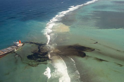 <span class="caption">MV Wakashio, a Japanese owned Panama-flagged bulk carrier ship leaks oil after drifting ashore over coral reefs.</span> <span class="attribution"><span class="source">Etat-major des Armees/EPAhandout</span></span>