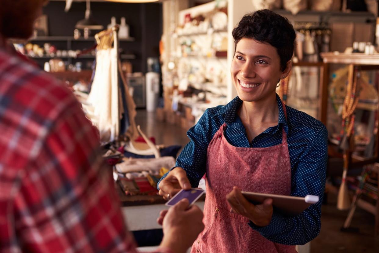 iStock-508316570 small business finds small business owner checking out at shop.jpg