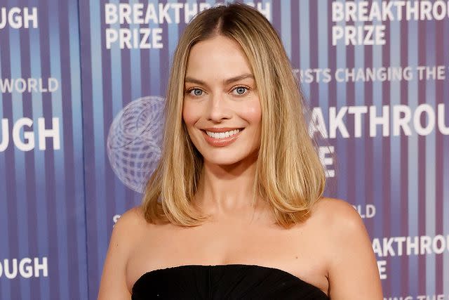<p>Taylor Hill/Getty Images</p> Margot Robbie debuts chic lob and darker hair color at the 2024 Breakthrough Prize ceremony on April 13