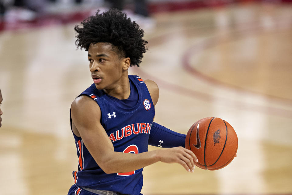 FAYETTEVILLE, ARKANSAS - JANUARY 20: Sharife Cooper #2 of the Auburn Tigers directs the offense in the second half of a game against the Arkansas Razorbacks at Bud Walton Arena on January 20, 2021 in Fayetteville, Arkansas. The Razorbacks defeated the Tigers 75-73.  (Photo by Wesley Hitt/Getty Images)