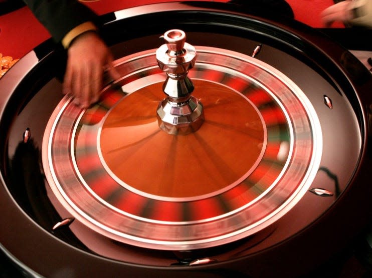 A croupier turns a roulette wheel.  REUTERS/Francois Lenoir 