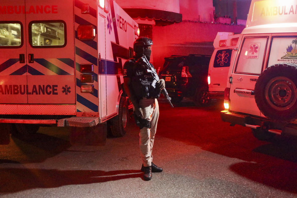 Police guard outside the hospital where Haiti's newly selected prime minister, Garry Conille was hospitalized in Port-au-Prince, Haiti, late Saturday, June 8, 2024. Louis Gérald Gilles, a member of the transitional presidential council that recently chose Conille said he was en route to the hospital and did not have further information. (AP Photo/Odelyn Joseph)