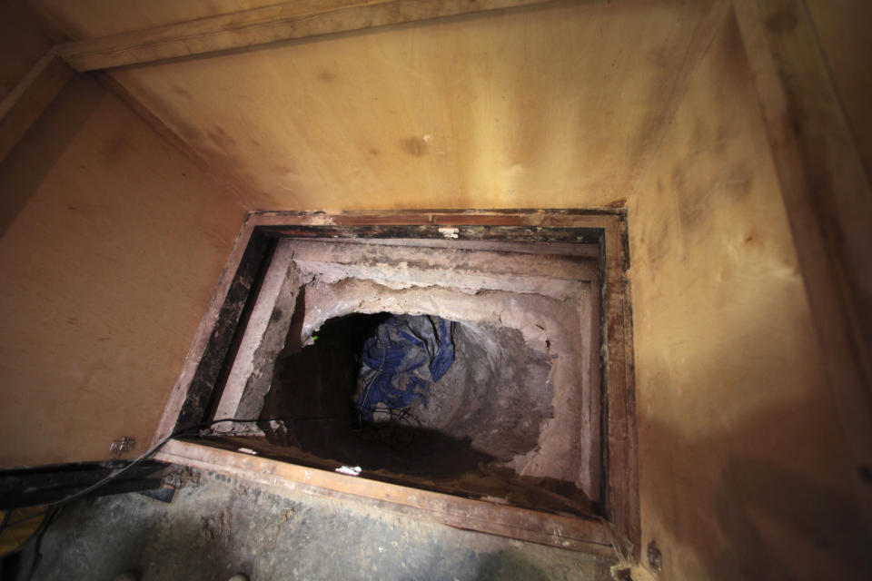 The entrance to a long tunnel is seen inside a warehouse near the Mexican border in Otay Mesa, California November 3, 2010. U.S. border police have found a sophisticated smuggler's tunnel the length of six football fields linking Southern California with Mexico and believed to have been used by drug traffickers, authorities said on Wednesday. Agents also recovered more than 20 tons of marijuana during overnight searches of the tunnel, the border patrol said in a news release. REUTERS/Nelvin C. Cepeda/San Diego Union-Tribune/Pool