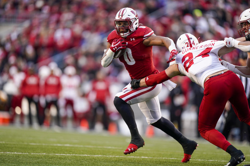 Wisconsin running back Braelon Allen (0) runs against Nebraska linebacker Blaise Gunnerson (24) during the first half of an NCAA college football game Saturday, Nov. 20, 2021, in Madison, Wis. (AP Photo/Andy Manis)