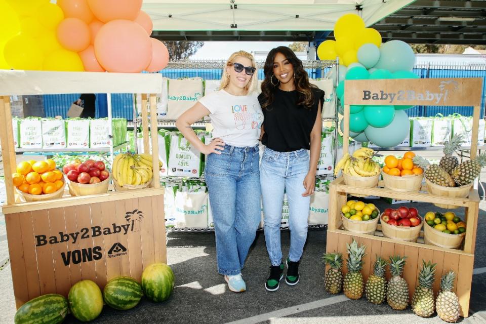 Kelly Rowland and Busy Philipps attend Baby2Baby’s B2B Safe Distribution event in Los Angeles on March 19, 2022. - Credit: Phillip Faraone/Getty Images