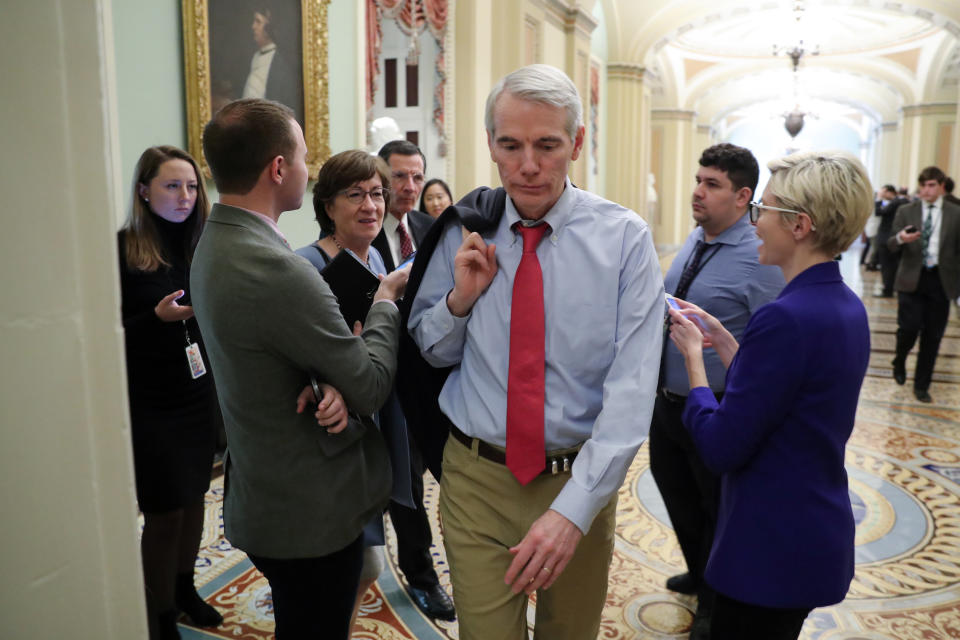 U.S. Senator Rob Portman (R-OH) walks past reporters as he, Senator Susan Collins (R-ME) and Senator John Barrasso (R-WY) depart a Republican Senate caucus meeting while budget legislation deadlines loom for a potential federal government shutdown at the U.S. Capitol in Washington, U.S., December 21, 2018. REUTERS/Jonathan Ernst