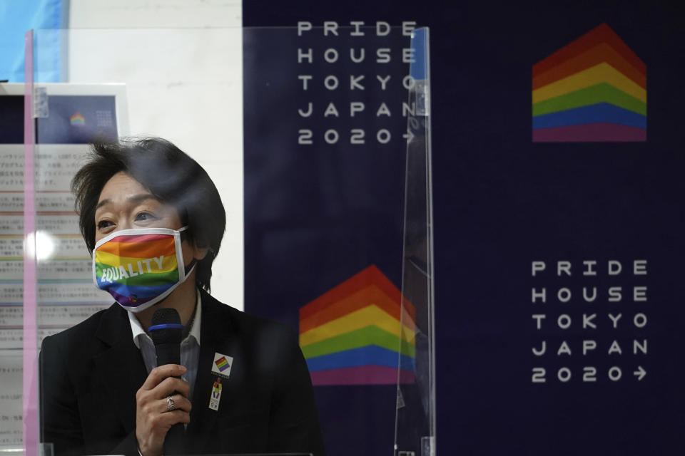 Tokyo 2020 Organizing Committee President Seiko Hashimoto wearing a rainbow-colored mask with word "Equality" speaks during her visit to Pride House Tokyo Legacy in Tokyo Tuesday, April 27, 2021. Japan marked LGBTQ week with pledge to push for equality law before the Olympics. (AP Photo/Eugene Hoshiko, Pool)