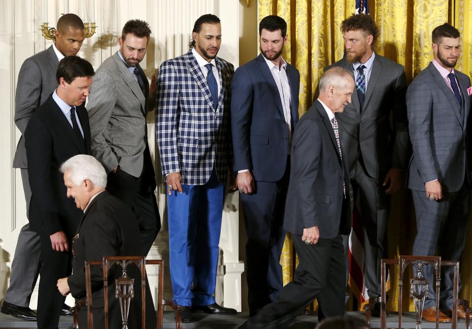 Outfielder Michael Morse (3rd L, top row) wears a plaid blazer and bright blue pants during a reception for the San Francisco Giants, Major League Baseball's 2014 World Series champions, in the East Room of the White House in Washington, June 4, 2015. Morse played on the 2014 Giants, but currently is a member of the Miami Marlins. REUTERS/Jonathan Ernst