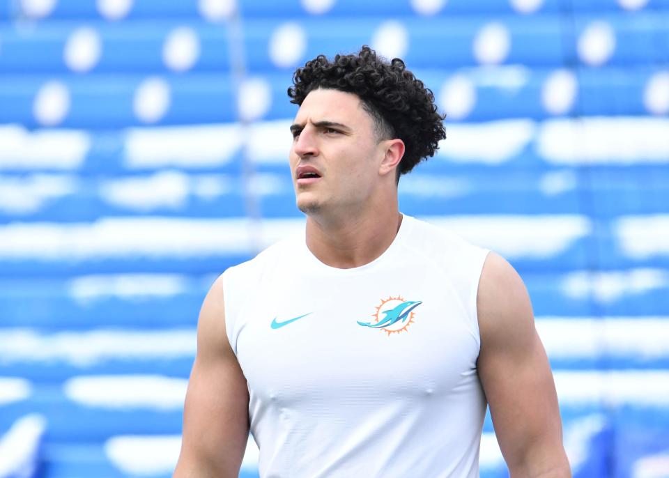 Jan 15, 2023; Orchard Park, NY, USA; Miami Dolphins linebacker Jaelan Phillips warms up before playing against the Buffalo Bills in a NFL wild card game at Highmark Stadium. Mandatory Credit: Mark Konezny-USA TODAY Sports