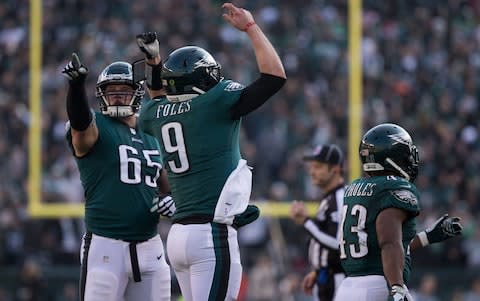 Philadelphia Eagles quarterback Nick Foles (9) and offensive tackle Lane Johnson (65) reacts with the fans during the second quarter against the Houston Texans at Lincoln Financial Field - Credit: USA TODAY