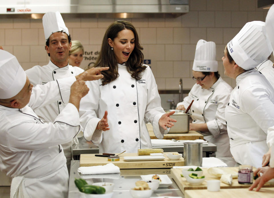 Catherine, Duchess of Cambridge, reacts during a cooking workshop at the Institut de tourisme et d'hotellerie du Quebec in Montreal July 2, 2011. Prince William and his wife Catherine are on a royal tour of Canada from June 30 to July 8.   REUTERS/Mathieu Belanger (CANADA - Tags: ENTERTAINMENT POLITICS ROYALS SOCIETY IMAGES OF THE DAY)