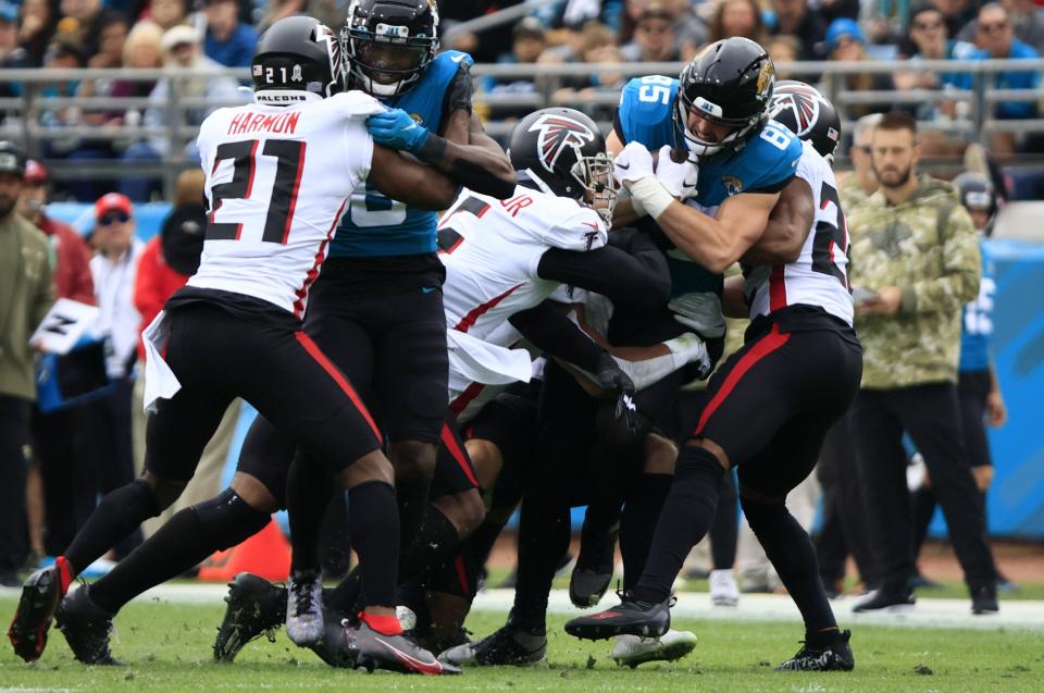 Jaguars' tight end Dan Arnold is gang-tackled by the Atlanta Falcons after making a catch in the second quarter of Sunday's game at TIAA Bank Field. Arnold sprained the MCL in his right knee on the play and was put on the injured reserve list.