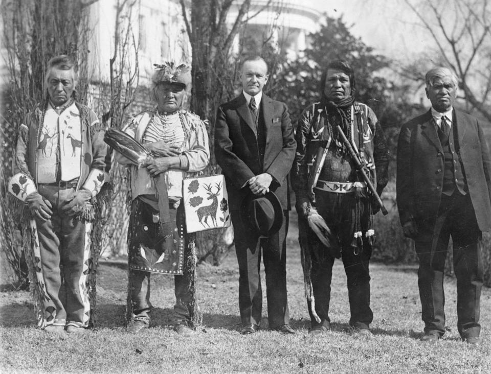 President Calvin Coolidge stands outside the White House with four Osage leaders after signing the Indian Citizenship Act. <a href="https://commons.wikimedia.org/wiki/File:1924_Indian_Citizenship_Act.jpg" rel="nofollow noopener" target="_blank" data-ylk="slk:National Photo Company Collection/Wikimedia Commons;elm:context_link;itc:0;sec:content-canvas" class="link ">National Photo Company Collection/Wikimedia Commons</a>