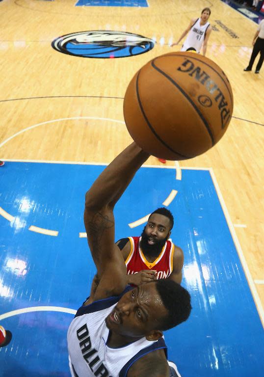 Al-Farouq Aminu of the Dallas Mavericks takes a shot against the Houston Rockets during Game 4 of the Western Conference quarter-finals of the NBA playoffs, at American Airlines Center in Dallas, Texas, on April 26, 2015