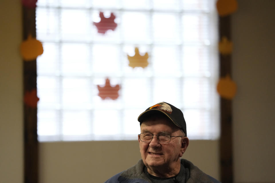 Earl Meyer, who fought for the U.S. Army in the Korean War, talks with fellow veterans at the American Legion, Tuesday, Nov. 7, 2023, in St. Peter, Minn. Meyer, 96, is suing the Army to try to get the Purple Heart medal that he says he earned when he was wounded during fierce combat in June of 1951. (AP Photo/Abbie Parr)