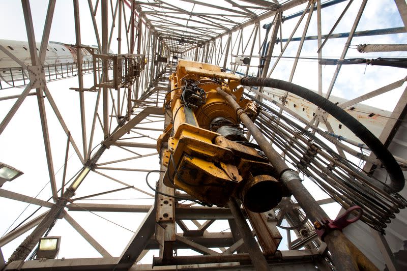 FILE PHOTO: The top drive of a drill sits idle on an oil rig in the Gulf of Mexico near Port Fourchon, Louisiana