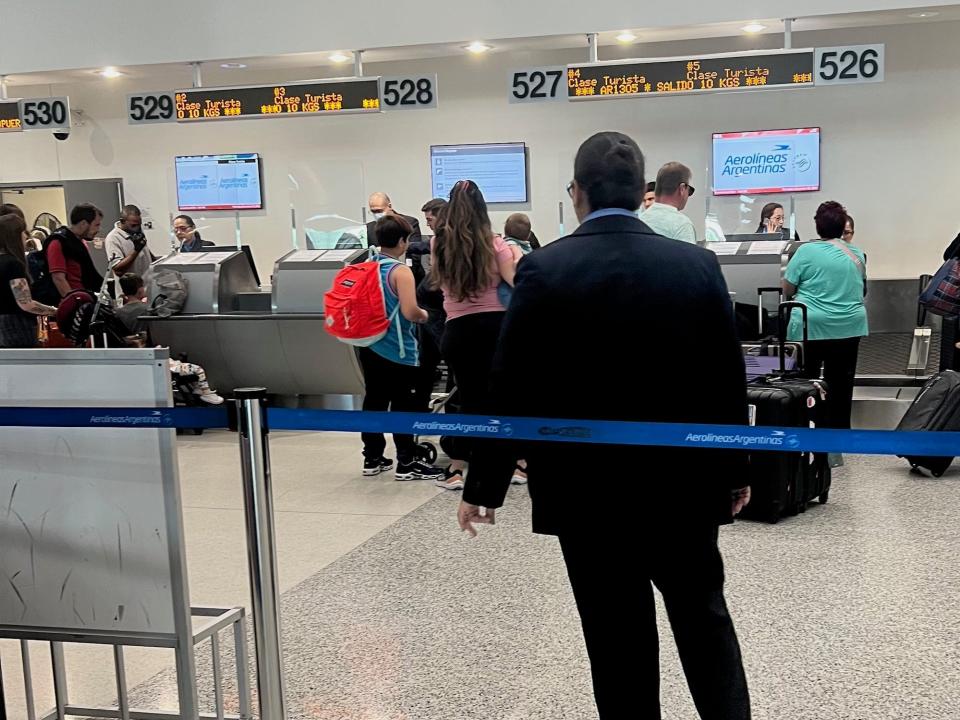 The check-in line for Aerolineas at Miami.