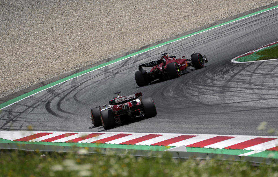 Ferrari driver Charles Leclerc of Monaco steers his car followed by Alfa Romeo driver Valtteri Bottas of Finland during the second practice session at the Red Bull Ring racetrack in Spielberg, Austria, Saturday, July 9, 2022. The Austrian F1 Grand Prix will be held on Sunday July 10, 2022. (AP Photo/Matthias Schrader)