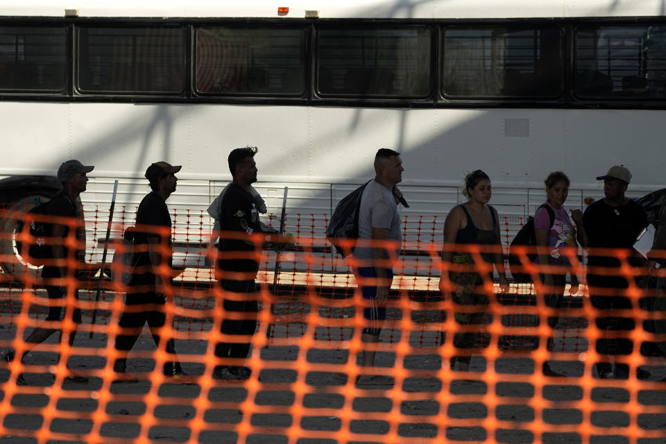Migrants who crossed the Rio Grande to the U.S. from Mexico are processed by U.S. Border Patrol agents, Friday, Sept. 22, 2023, in Eagle Pass, Texas. (AP Photo/Eric Gay)