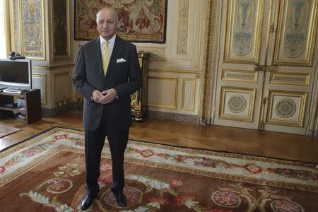 French Foreign Affairs Minister Laurent Fabius poses in his office in Paris, France, May 22, 2015, prior to an interview with Reuters. REUTERS/Philippe Wojazer