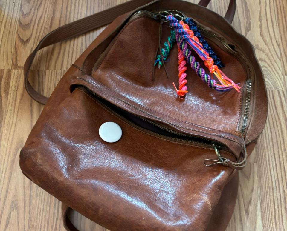 If your bag or backpack has a pocket, you can just toss in AirTags (shown here outside the pocket). (Jeanine Edwards/Yahoo News)