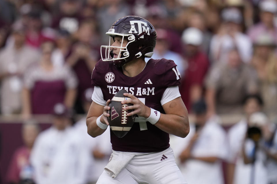 Texas A&M quarterback Max Johnson (14) looks to pass against Alabama during the second half of an NCAA college football game Saturday, Oct. 7, 2023, in College Station, Texas. (AP Photo/Sam Craft)