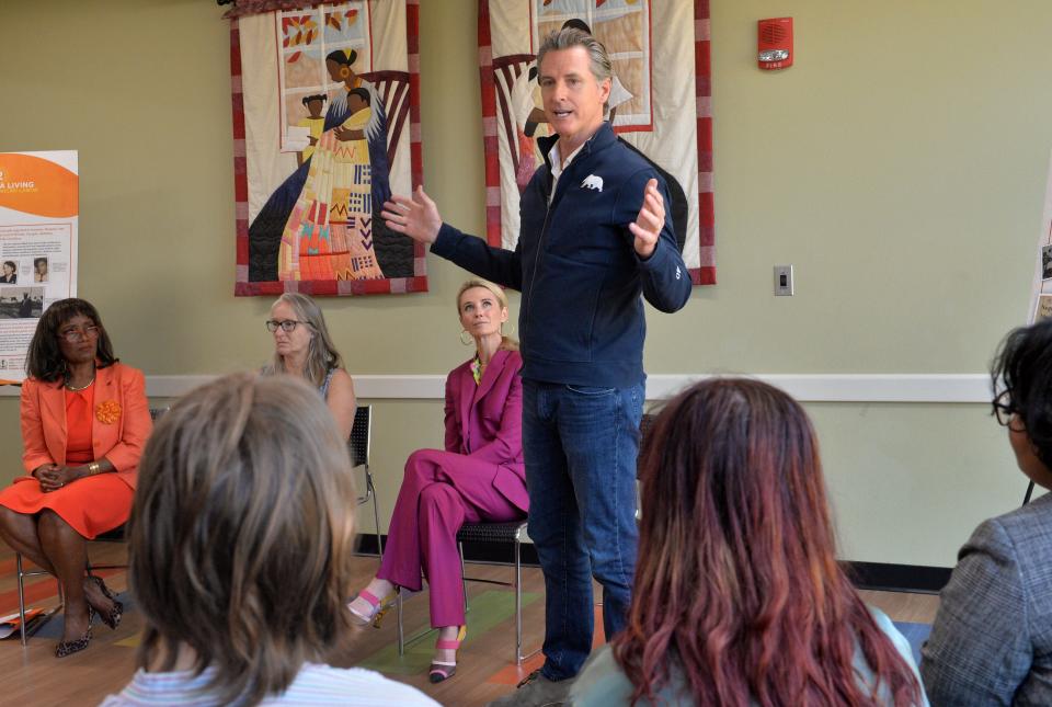 California Gov. Gavin Newsom speaks to students from New College of Florida about his recent week-long trip across the South, during Newsom's stop on Wednesday  at the Betty J. Johnson North Sarasota Public Library in Sarasota. 