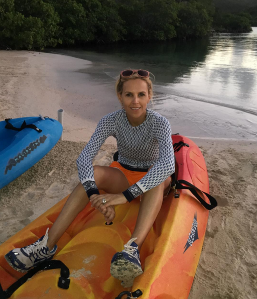 Tory Burch on vacation wearing Tory Sport and her massive engagement ring from Pierre-Yves Roussel. 