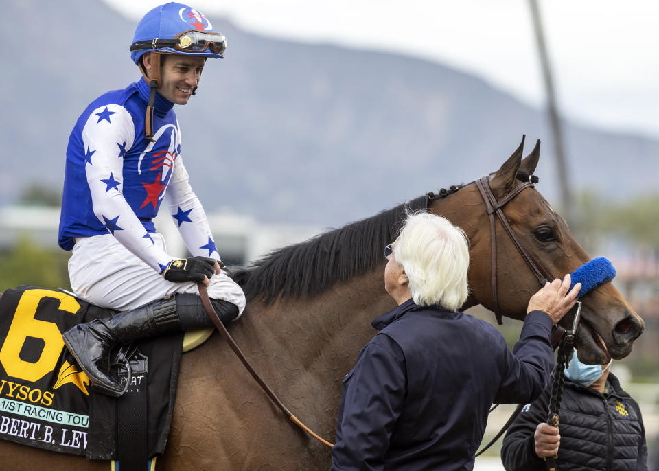 Nysos' trainer Bob Baffert congratulates jockey Flavien Prat after winning the Grade III $200,000 Robert B. Lewis Stakes horse race, Saturday, Feb. 3, 2024 at Santa Anita Park, Arcadia, Calif. (Benoit Photo via AP)