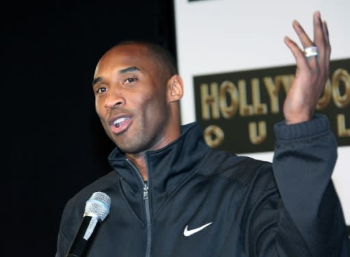 Former Los Angeles Lakers star Kobe Bryant, killed last month in a plane crash, is shown at a 2011 hand and footprint ceremony at Grauman's Chinese Theater, the casting of which is among the items set to be put on the auction block in April