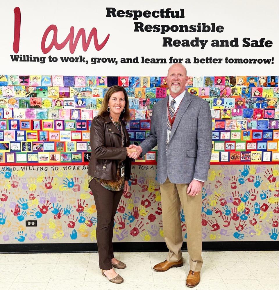 Linden Elementary School Principal Heather Jenkins shakes hands with Oak Ridge Schools Superintendent Bruce Borchers. Linden is one of only six schools in Tennessee to be named a National Blue Ribbon School by the U.S. Department of Education this year.