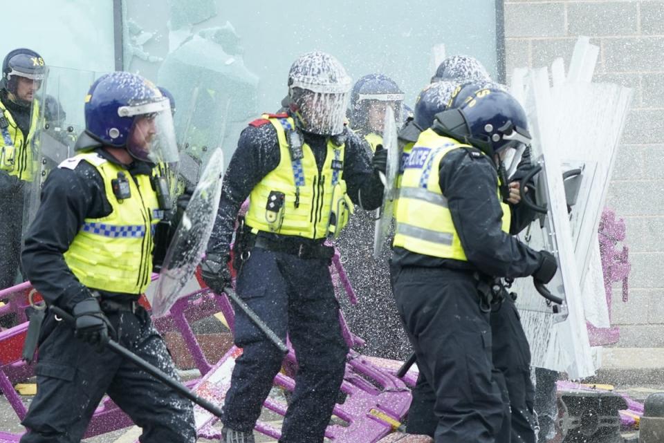 Police in riot gear clash with protesters (Danny Lawson/PA Wire)