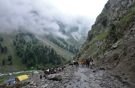 Hindu pilgrims trek through mountains to reach the holy Amarnath cave shrine, near Pahalgam