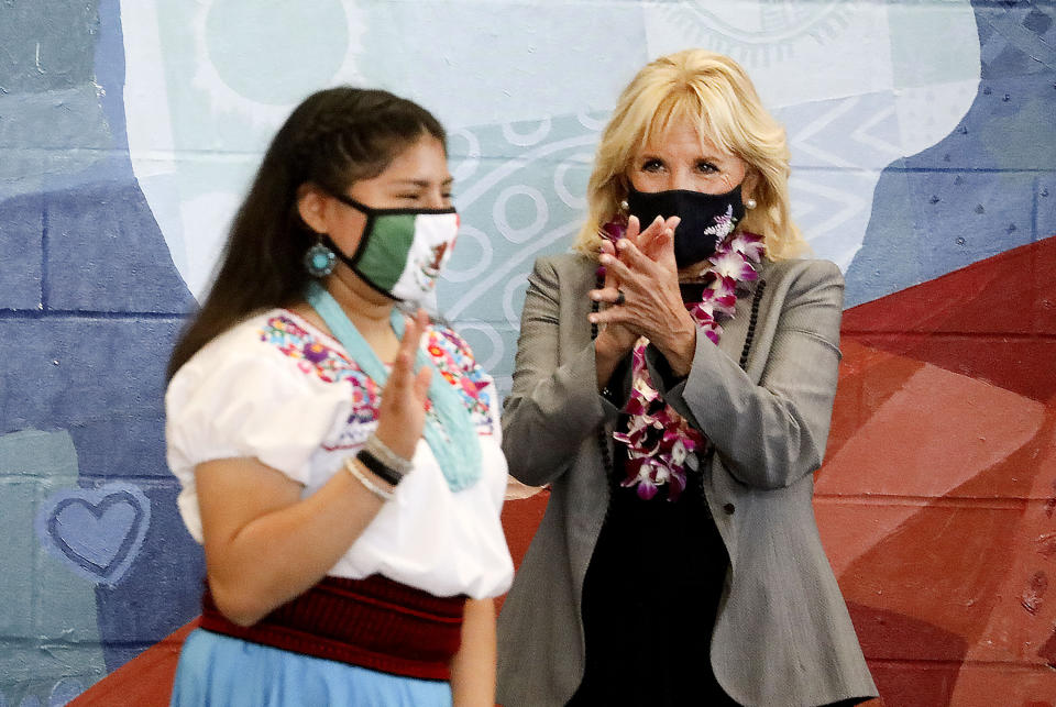 Glendale Middle School eighth grader Rosa Sanchez receives applause from first lady Jill Biden as she walks to the podium to speak at Glendale Middle School in Salt Lake City, Wednesday, May 5, 2021. Biden visited the school to thank teachers for their diligence and hard work during the pandemic. (Laura Seitz/The Deseret News via AP)