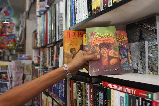 A Palestinian youth holds an Arabic tran