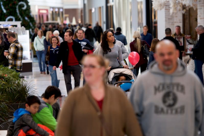 FILE PHOTO: Shoppers walk through the King of Prussia Mall, United States' largest retail shopping space, in King of Prussia