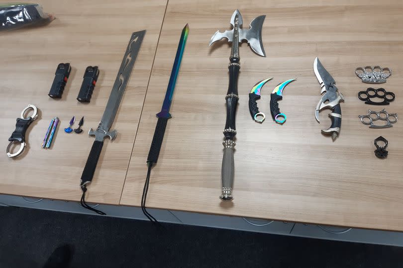 Weapons seized after a bouncer was sprayed in the face with a substance in Warrington