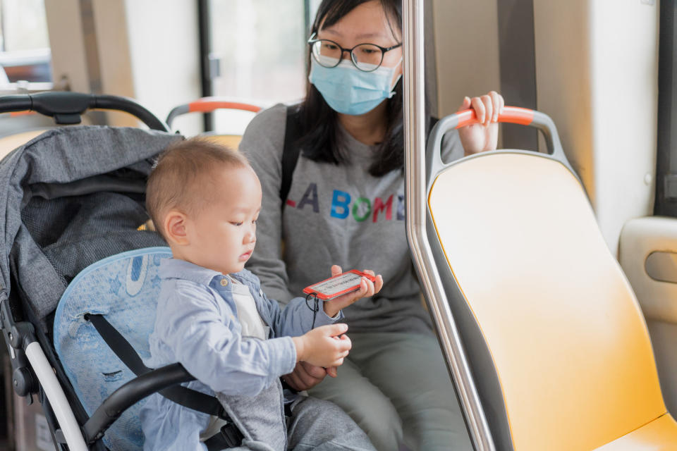 mother with her baby on the bus