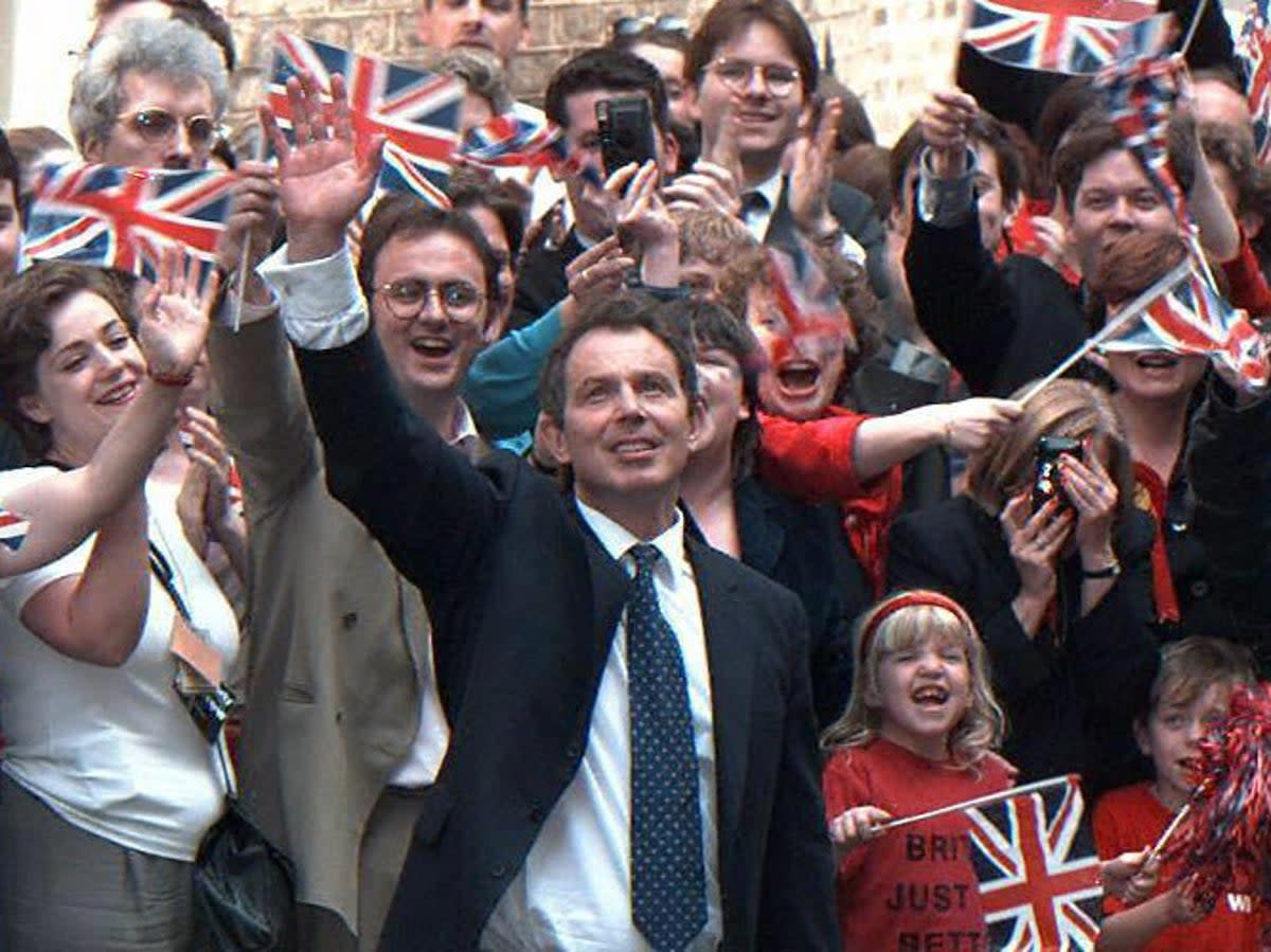 Tony Blair waves to his supporters upon his arrival at Downing Street, after winning the 1997 general election against John Major (AFP/Getty Images)