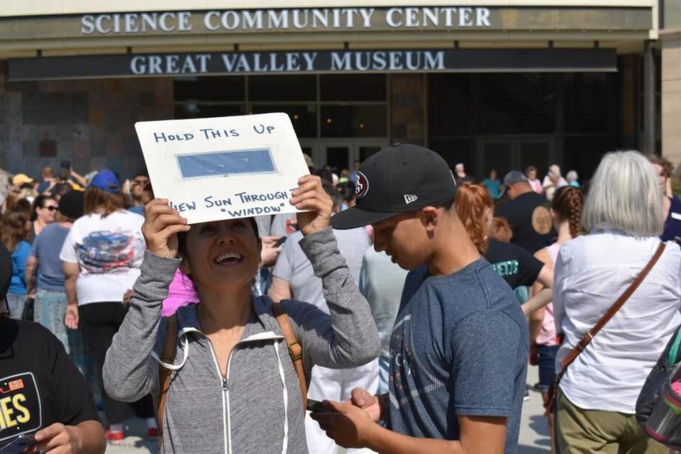 Modesto Junior College student Gabriela Diaz watches the eclipse through a solar filter on the college’s west campus on Monday, Aug. 21, 2017, in Modesto. A partial solar eclipse can be seen in California on Monday, April 8, 2024.