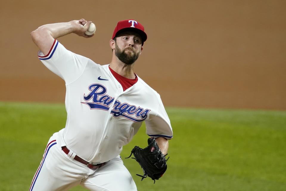 Texas Rangers starting pitcher Jordan Lyles throws to an Arizona Diamondbacks batter during the first inning of a baseball game in Arlington, Texas, Wednesday, July 28, 2021. (AP Photo/Tony Gutierrez)