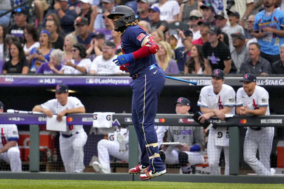 American League's Vladimir Guerrero Jr., of the Toronto Blue Jays, watches his solo home run take flight during the third inning of the MLB All-Star baseball game, Tuesday, July 13, 2021, in Denver. (AP Photo/Jack Dempsey)